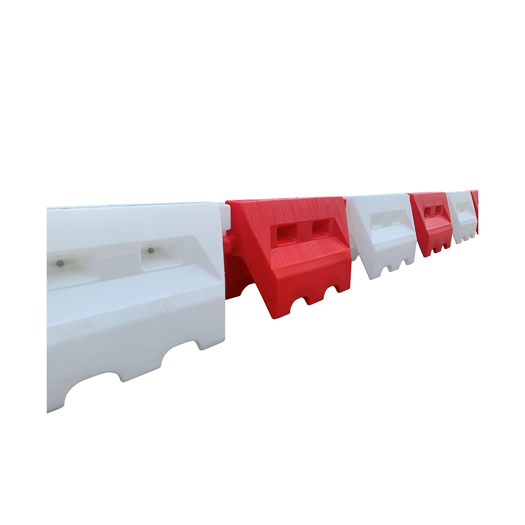 Side view of connected traffic separators on a white background