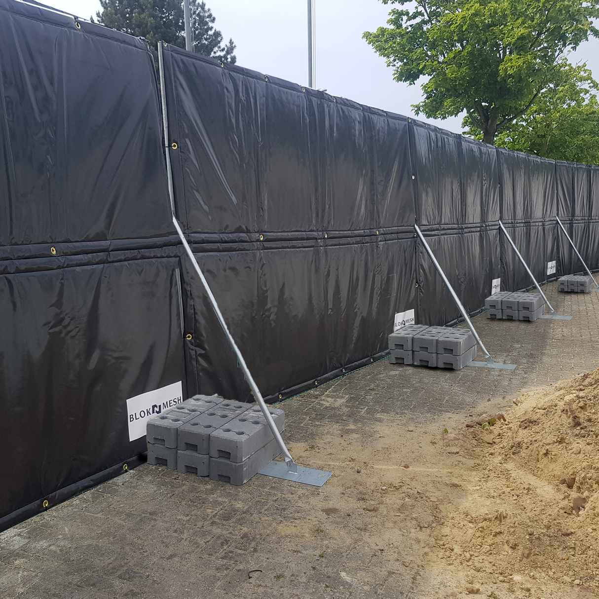 Acoustic shields attached to the fence panels stabilized with support braces